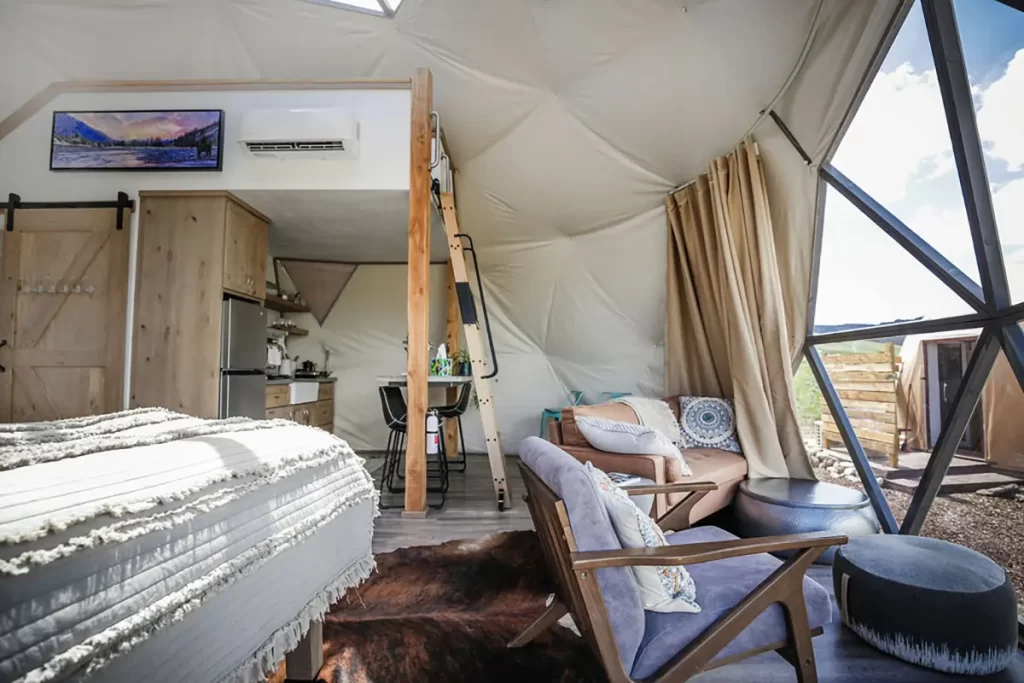 Interior of lodging dome, facing kitchen and bed