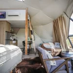 Interior of lodging dome, facing kitchen and bed